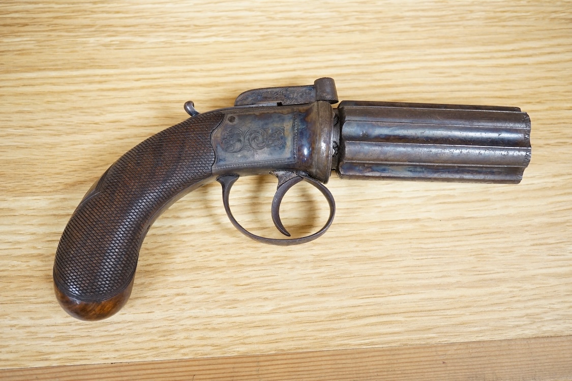 A six shot 80 bore, self-cocking, pepperbox revolver signed; W. Dooley, Liverpool, with foliate engraved frame and fluted barrel, Birmingham proved, and one piece rounded chequered walnut grip, together with a small copp